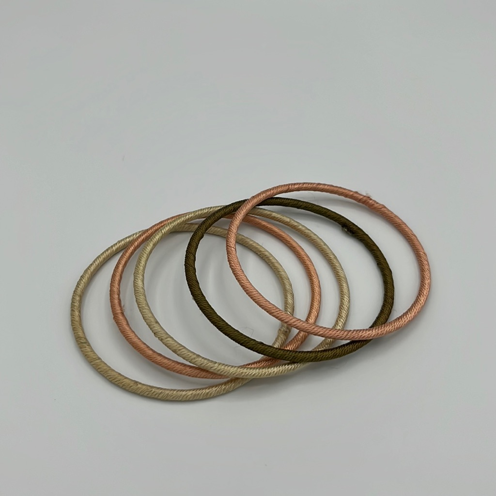 Bangle Bracelets Wrapped In Thread.